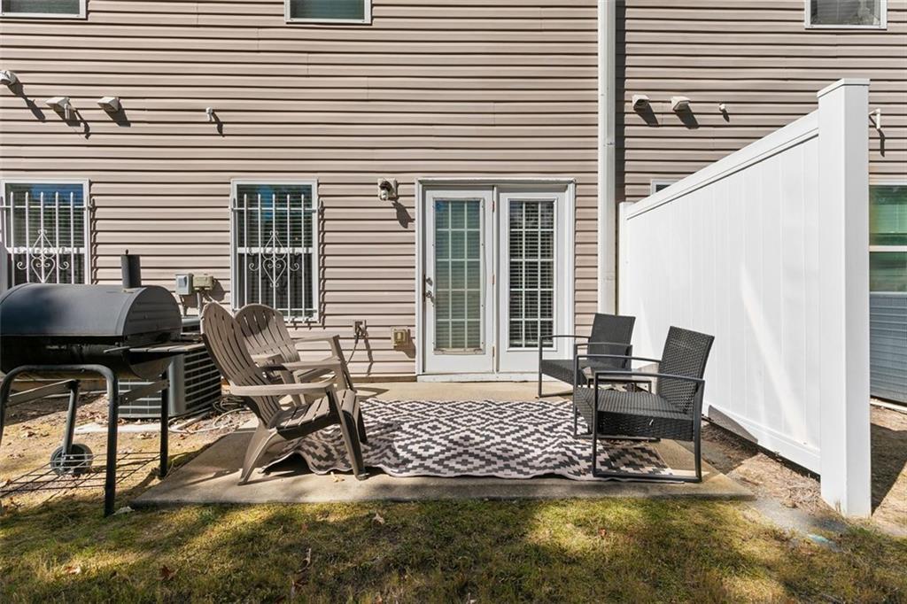 2555 Flat Shoals Road, Unit 5 Atlanta, GA 30349 - Photo 20 of 24 a view of a lounge chairs in back side of the house