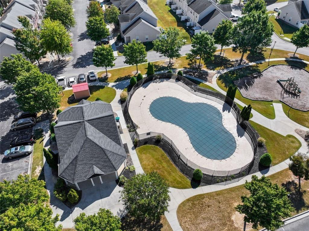 2555 Flat Shoals Road, Unit 5 Atlanta, GA 30349 - Photo 21 of 24 an aerial view of residential house with outdoor space and swimming pool