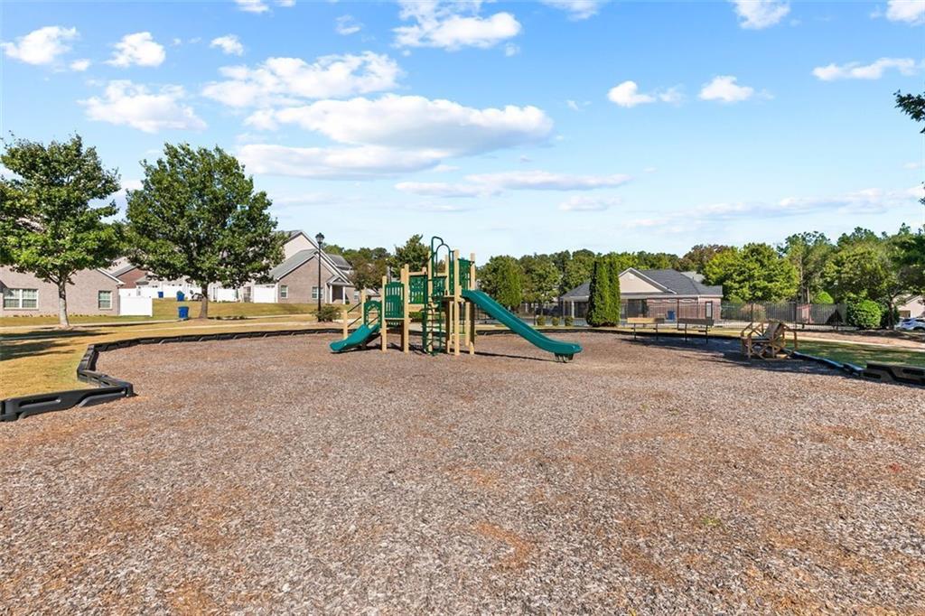 2555 Flat Shoals Road, Unit 5 Atlanta, GA 30349 - Photo 23 of 24 a view of a park with swings