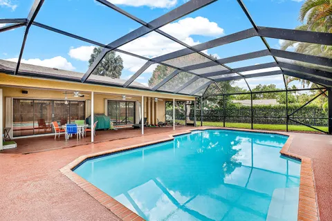 a view of a swimming pool with a patio