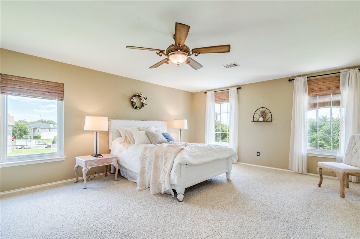 200 South Prairie Lane Georgetown, TX 78633 - Photo 14 of 28 a bedroom with a bed and a window