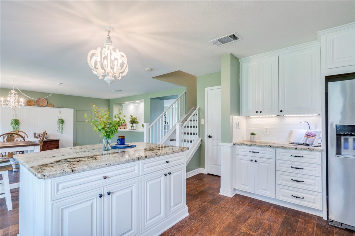 200 South Prairie Lane Georgetown, TX 78633 - Photo 9 of 28 a view of a kitchen counter space a sink stainless steel appliances and cabinets