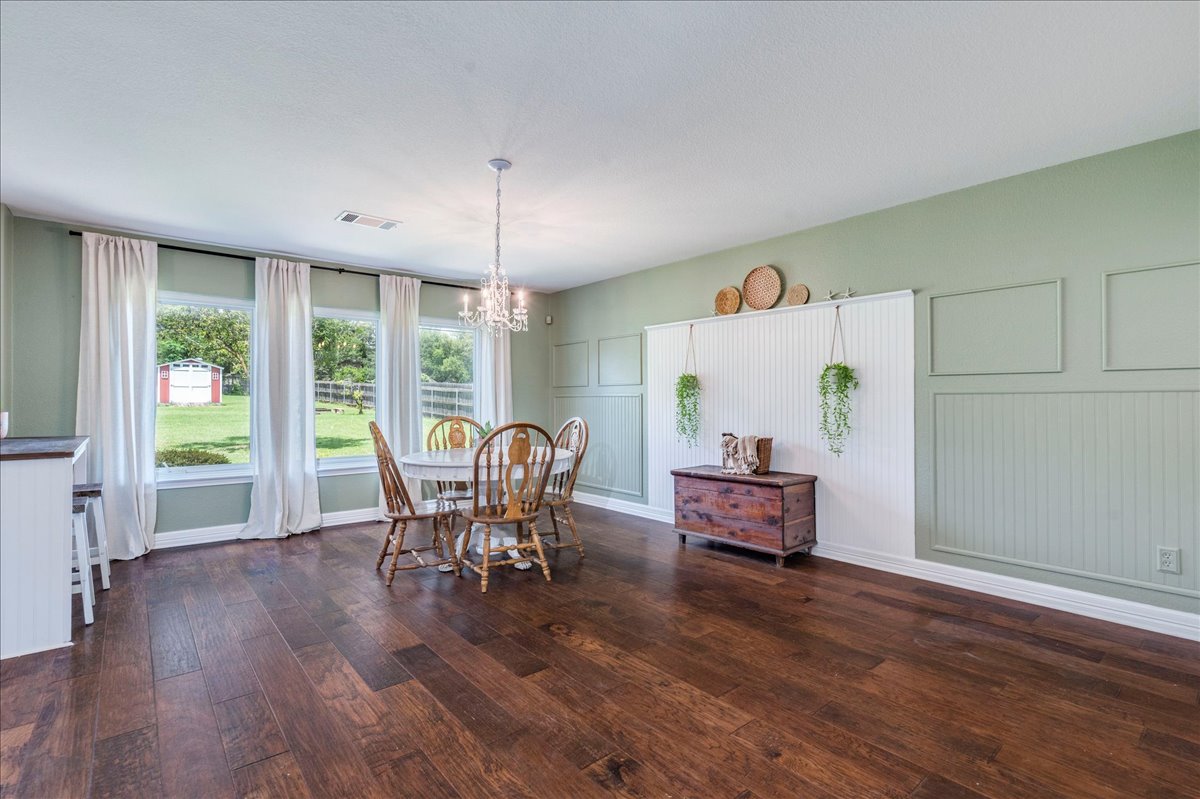 200 South Prairie Lane Georgetown, TX 78633 - Photo 10 of 28 a dining room with furniture window wooden floor