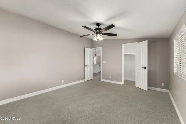 a view of an empty room with a window