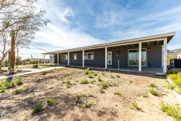 a view of house with yard
