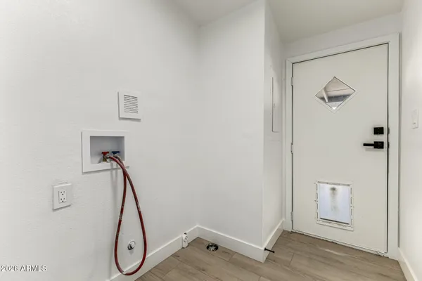 a view of a room with rack on the wall