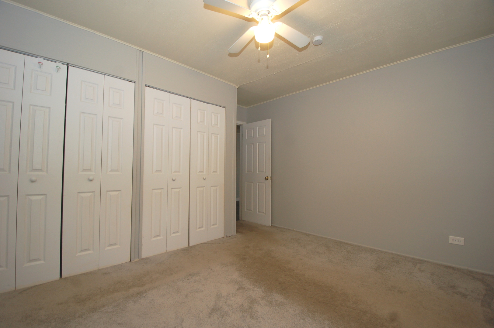 2713 Wilke Road Rolling Meadows, IL 60008 - Photo 9 of 14 an empty room with a chandelier fan