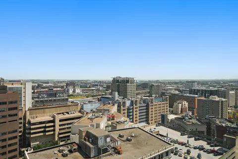 a view of a livingroom with furniture and a flat screen tv