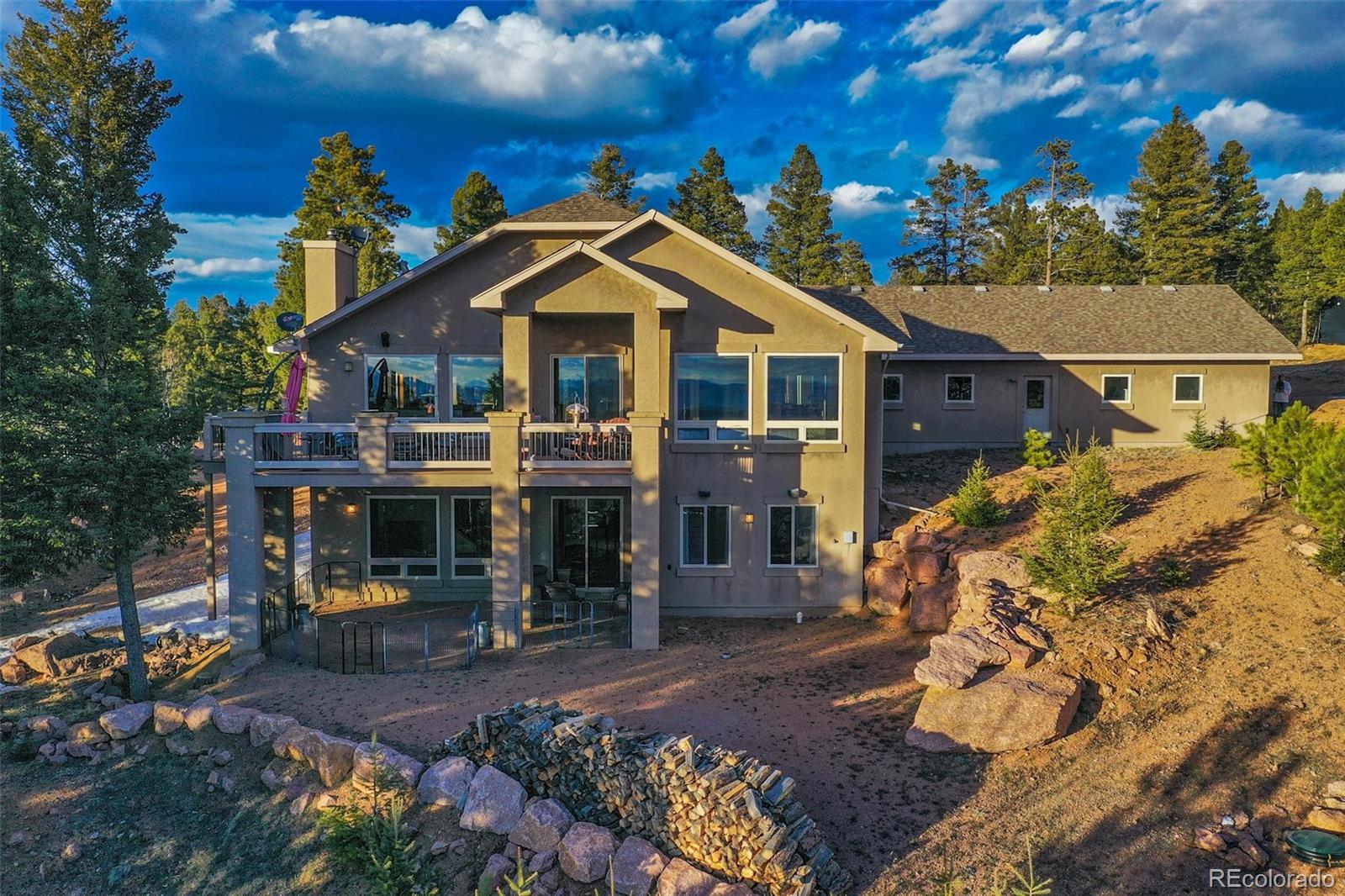 290 North Mountain Estates Road Florissant, CO 80816 - Photo 9 of 12 front view of a house with a street