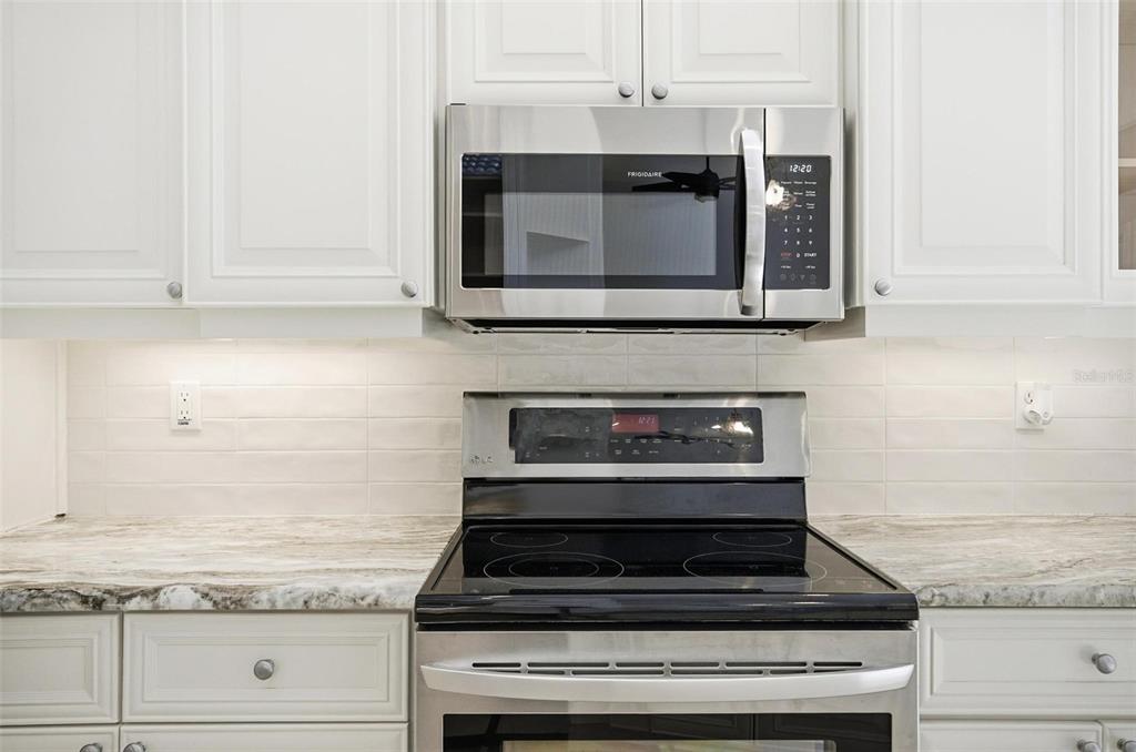 16 Village View Way Palm Coast, FL 32137 - Photo 12 of 89 a stove top oven sitting inside of a kitchen