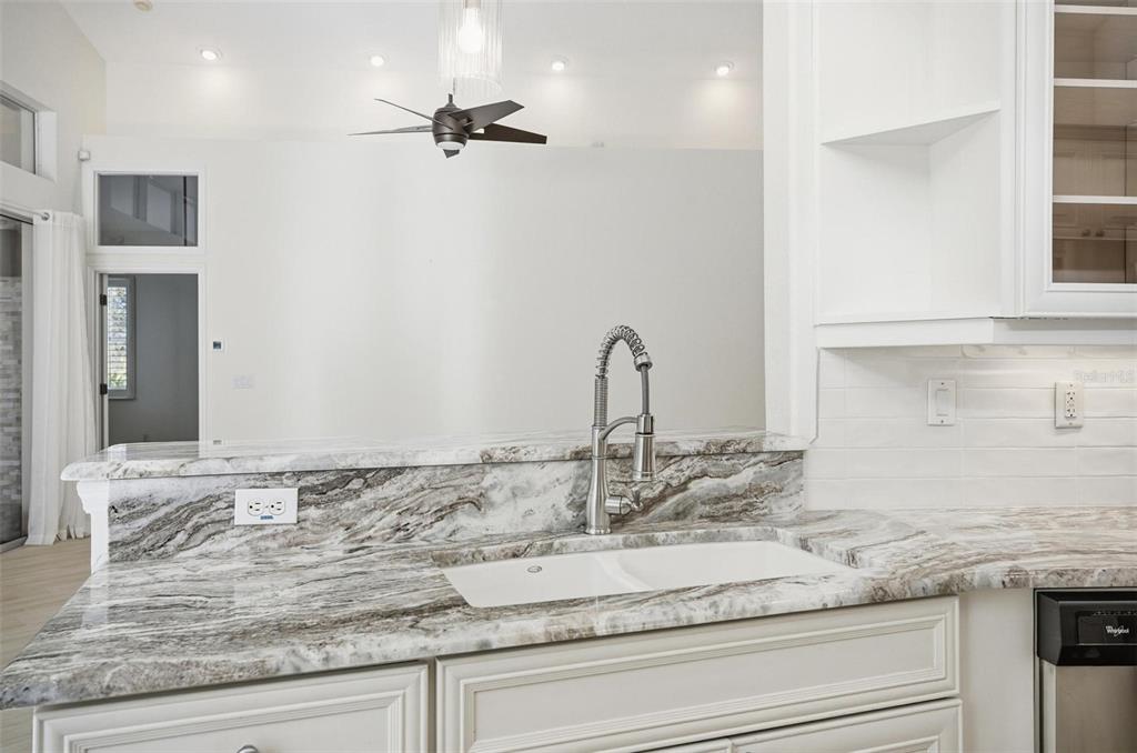 16 Village View Way Palm Coast, FL 32137 - Photo 16 of 89 a bathroom with a granite countertop sink and a mirror