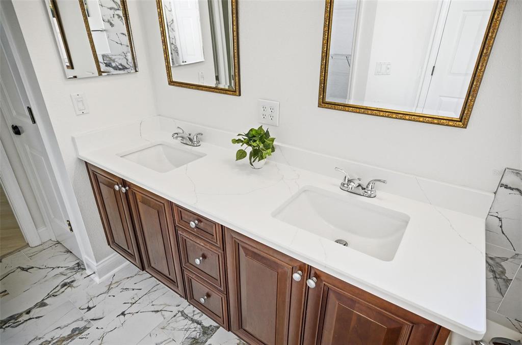 16 Village View Way Palm Coast, FL 32137 - Photo 35 of 89 a bathroom with a sink and a mirror
