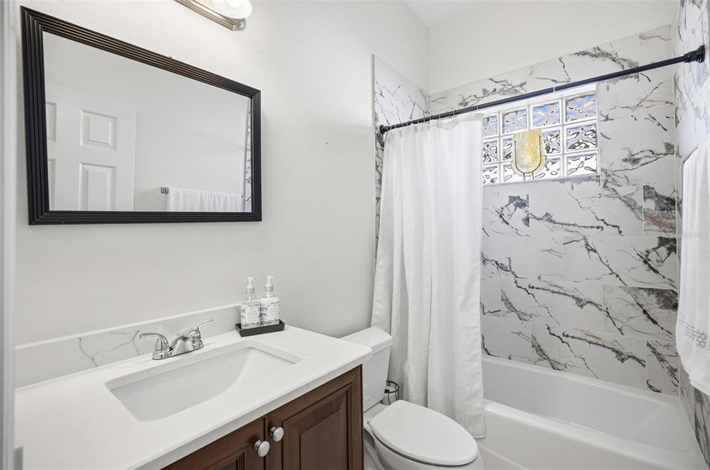 16 Village View Way Palm Coast, FL 32137 - Photo 43 of 89 a bathroom with a sink vanity mirror and toilet