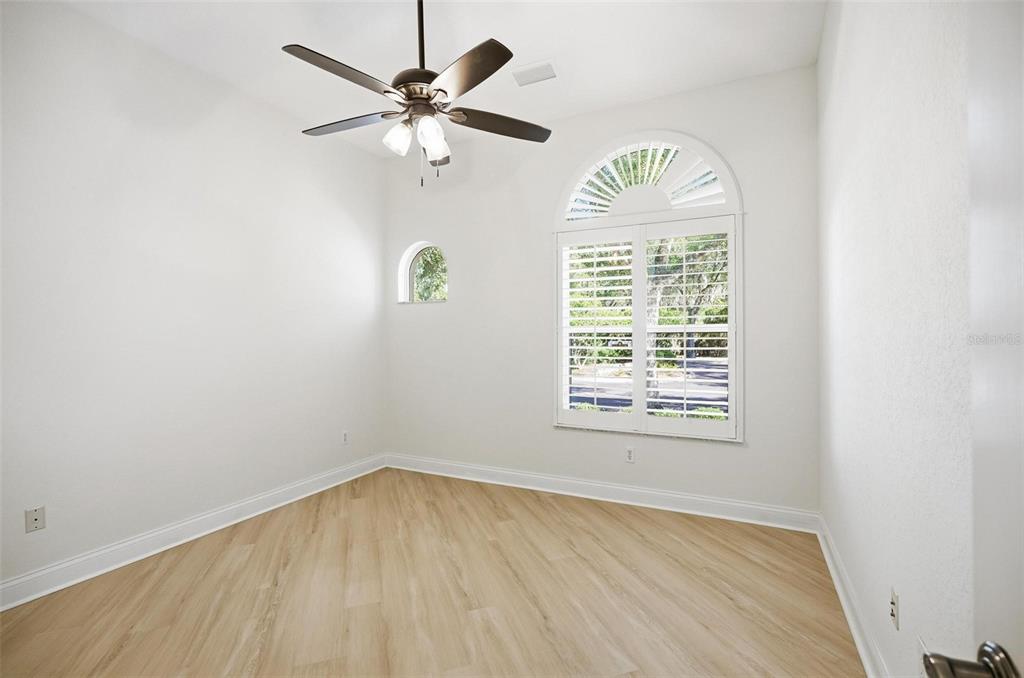 16 Village View Way Palm Coast, FL 32137 - Photo 46 of 89 an empty room with a window and a fan