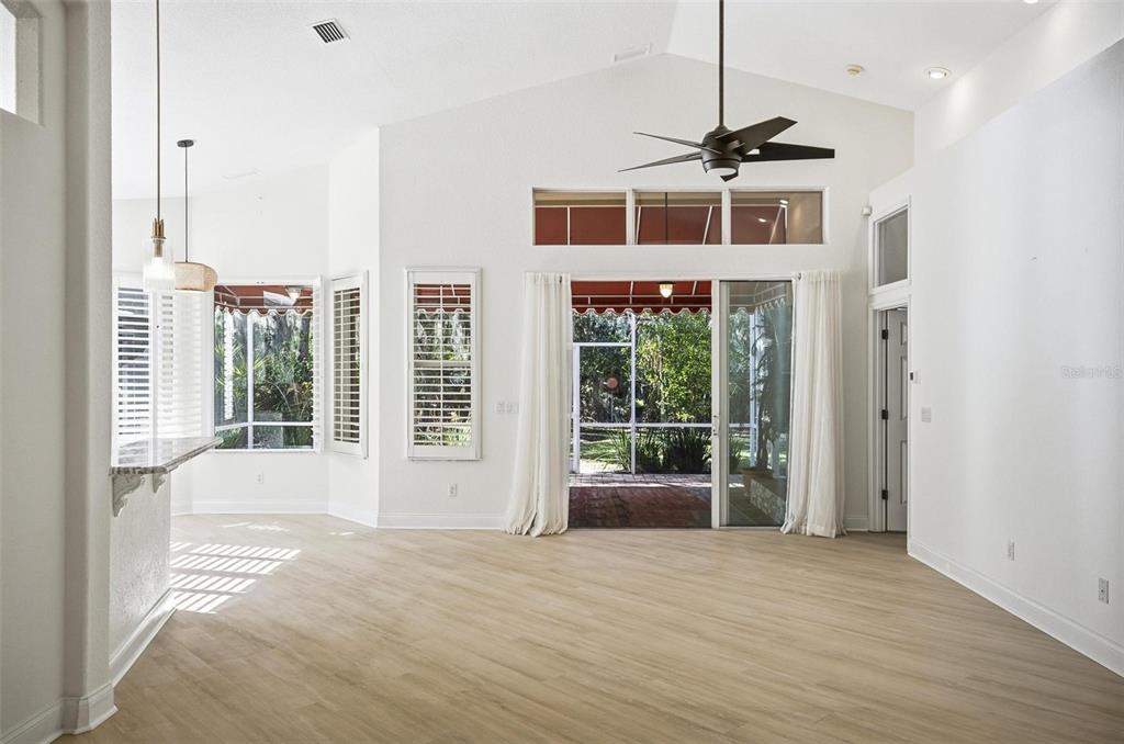 16 Village View Way Palm Coast, FL 32137 - Photo 8 of 89 a view of a room with a large window and chandelier