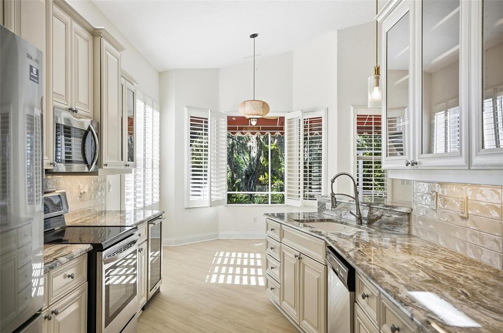 16 Village View Way Palm Coast, FL 32137 - Photo 10 of 89 a kitchen with granite countertop a sink and a stove