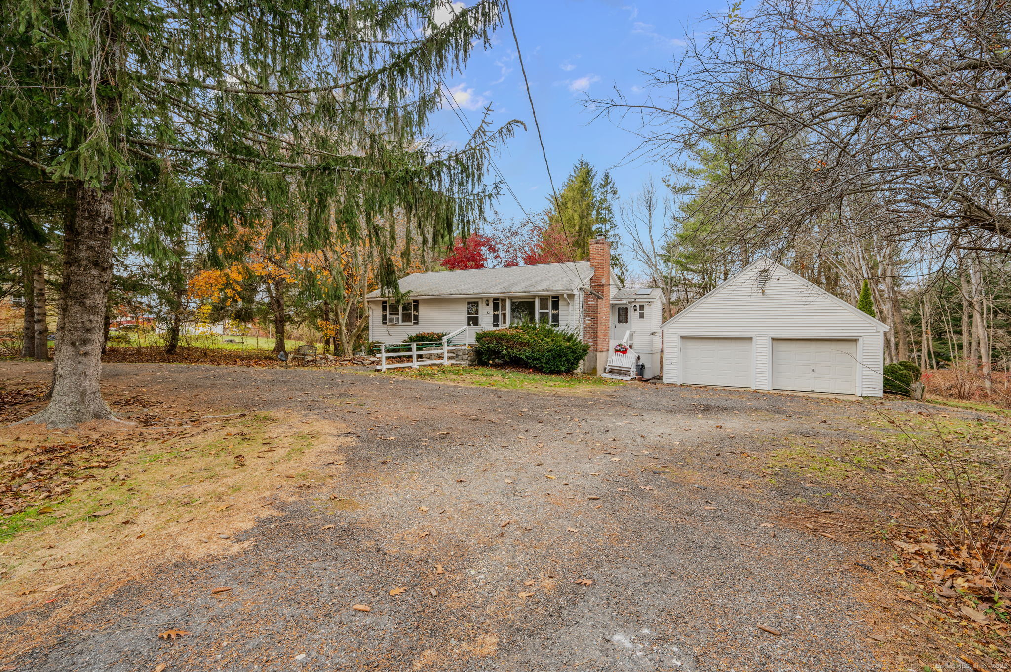 53 Falls Road East Haddam, CT 06469 - Photo 1 of 1 a front view of a house with a yard and garage