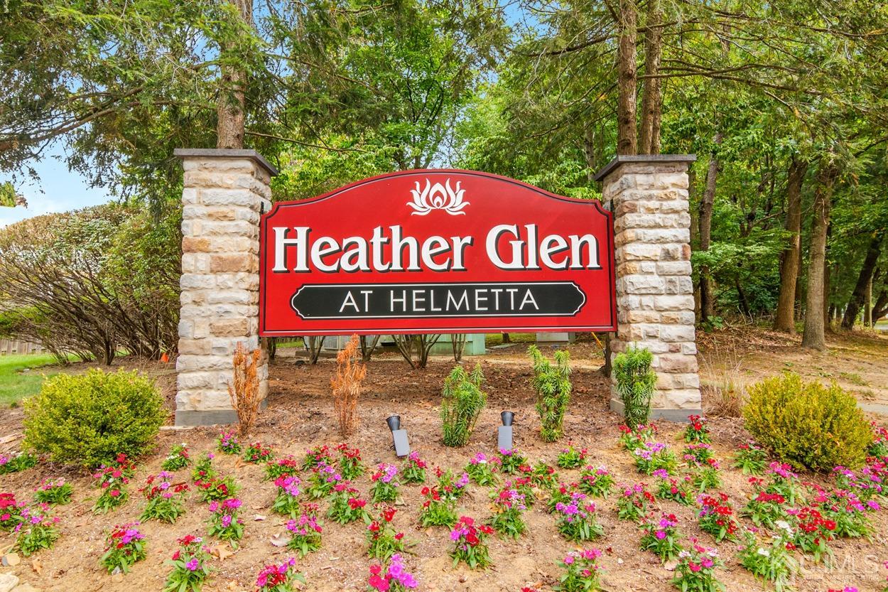 205 Raintree Court Helmetta, NJ 08828 - Photo 1 of 25 a sign on the side of a building