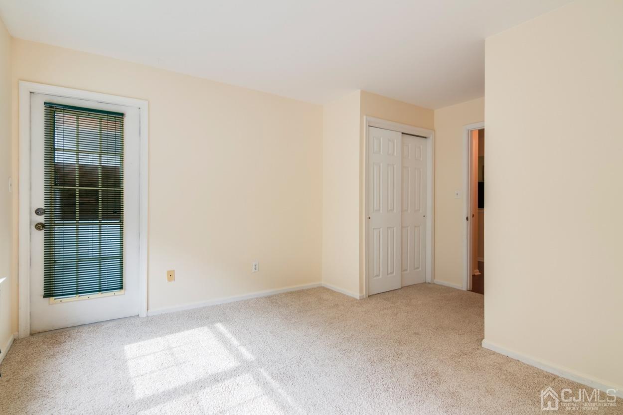 205 Raintree Court Helmetta, NJ 08828 - Photo 14 of 25 an empty room with windows