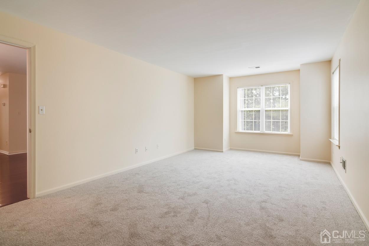 205 Raintree Court Helmetta, NJ 08828 - Photo 16 of 25 an empty room with windows