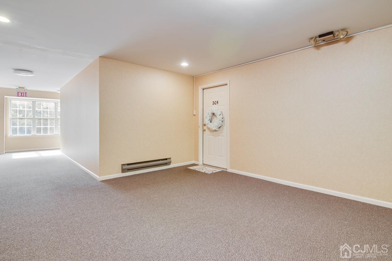 205 Raintree Court Helmetta, NJ 08828 - Photo 3 of 25 an empty room with windows