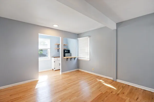 a view of a kitchen with wooden floor