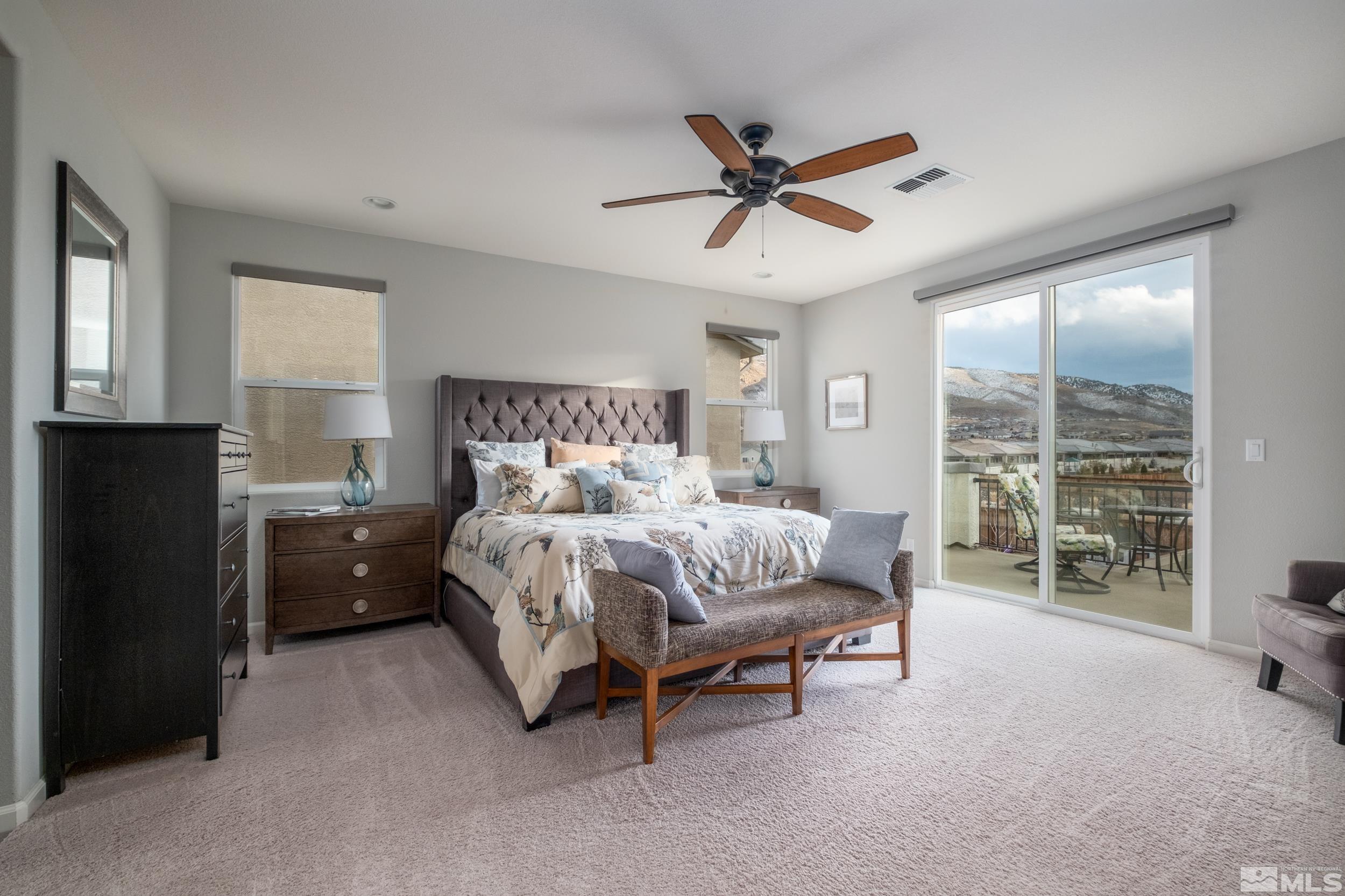 2960 Ethelinda Way Reno, NV 89521 - Photo 20 of 40 a bedroom with a bed and a chandelier