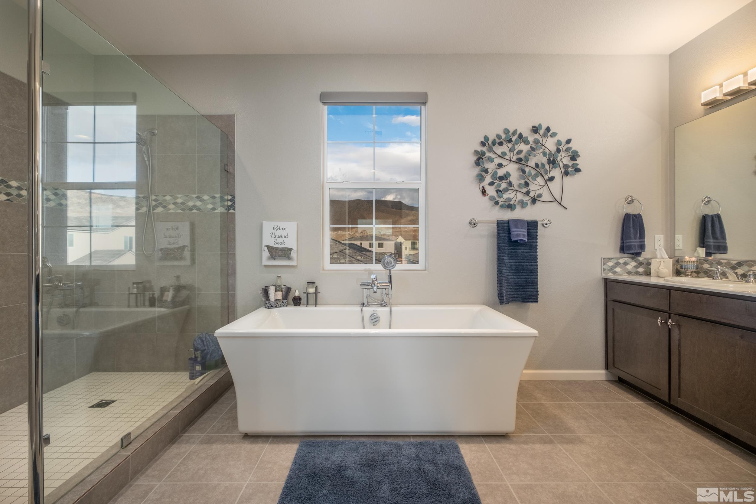 2960 Ethelinda Way Reno, NV 89521 - Photo 24 of 40 a white bath tub sitting next to a bathroom sink