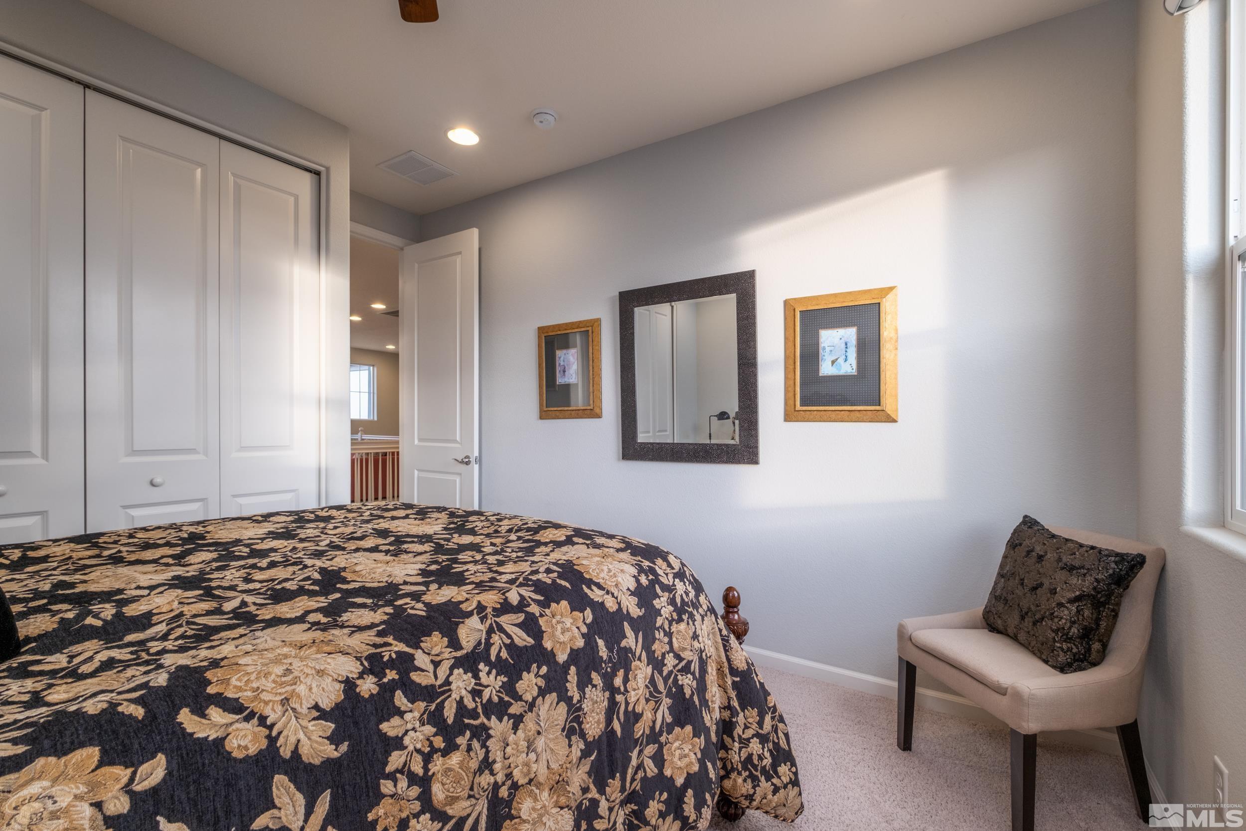 2960 Ethelinda Way Reno, NV 89521 - Photo 29 of 40 a bedroom with a bed and a couch