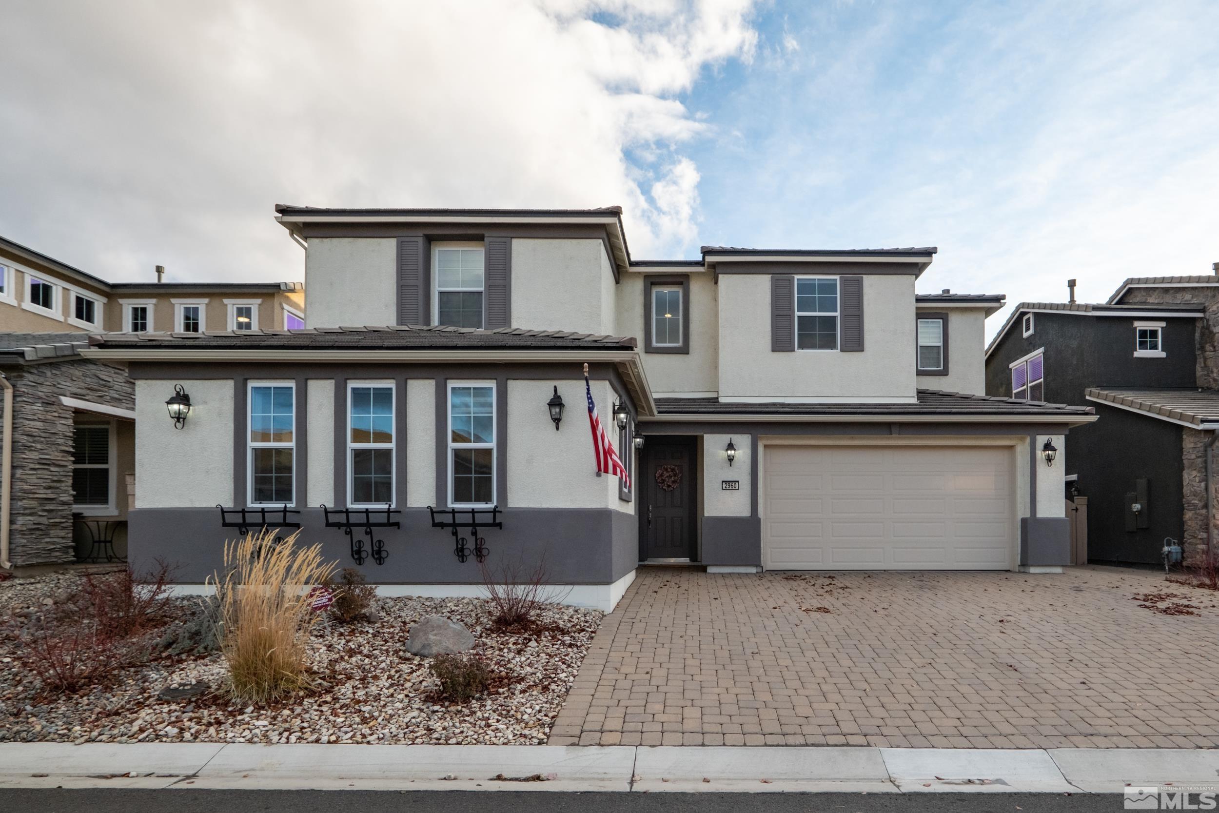 2960 Ethelinda Way Reno, NV 89521 - Photo 3 of 40 a front view of a house with garden