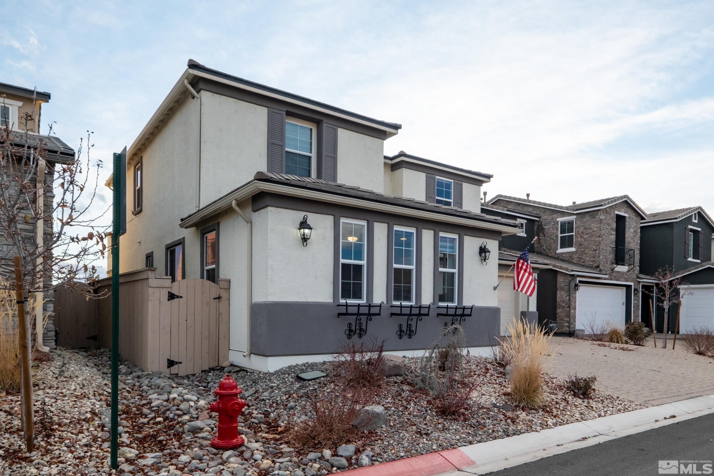2960 Ethelinda Way Reno, NV 89521 - Photo 4 of 40 a front view of a house with street