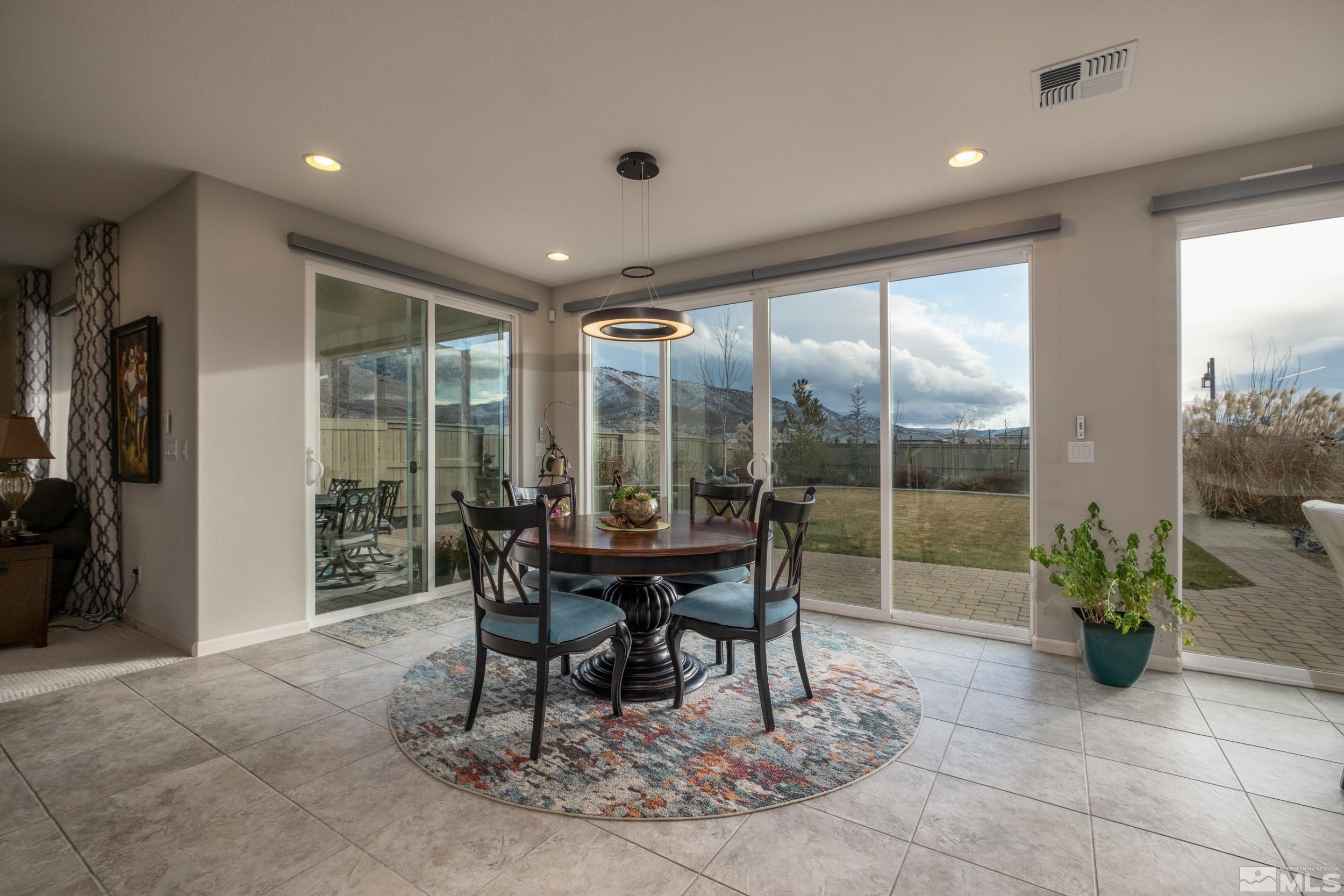 2960 Ethelinda Way Reno, NV 89521 - Photo 9 of 40 a dining room with furniture and a floor to ceiling window