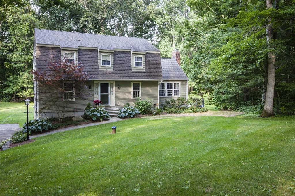 58 Robin Ridge Drive Madison, CT 06443 - Photo 1 of 1 a front view of a house with a garden