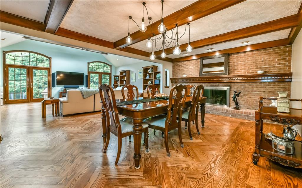2785 Clearview Road Allison Park, PA 15101 - Photo 5 of 25 Wood Beams, Fireplace and Herringbone Design Hardwood Floors frame the Great Room and Dining Room!