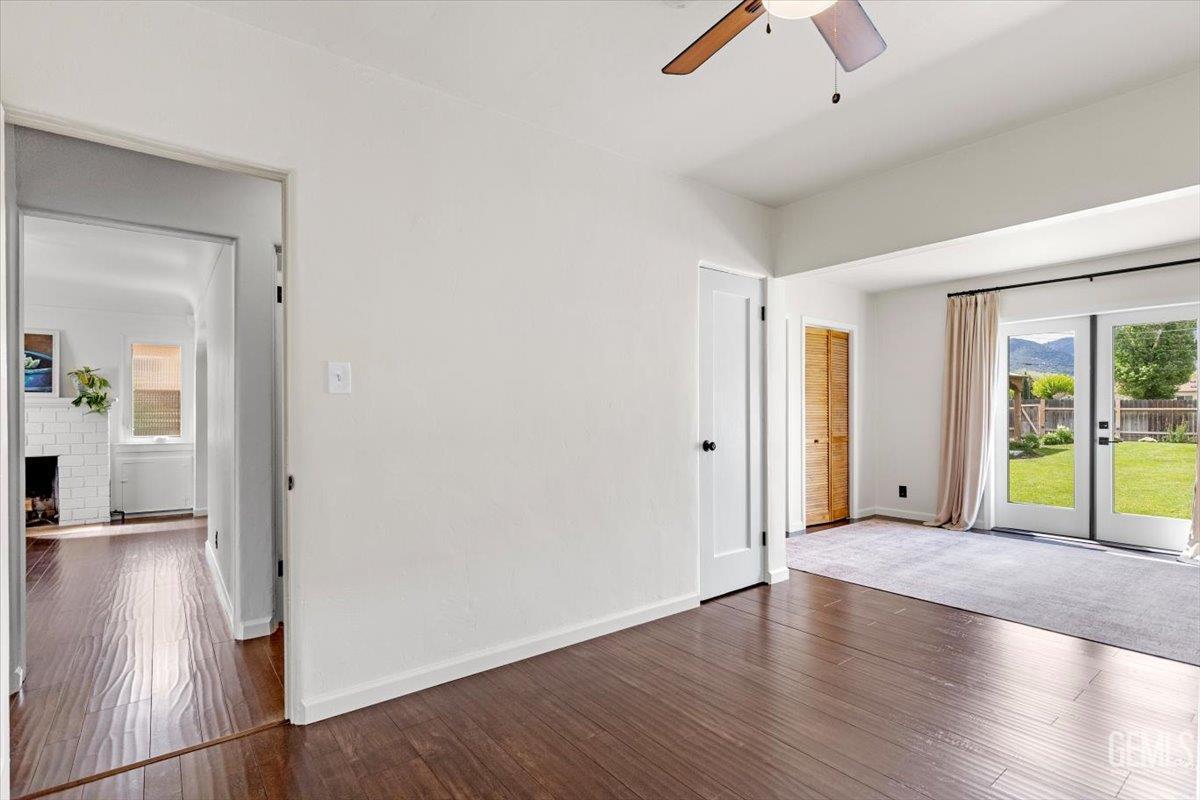 Undisclosed Address Tehachapi, CA 93561 - Photo 20 of 46 an empty room with wooden floor and windows