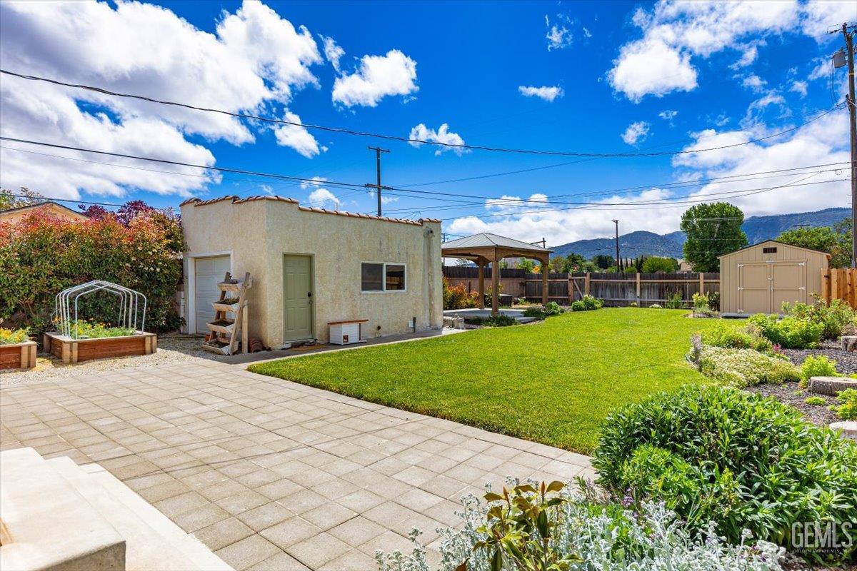 Undisclosed Address Tehachapi, CA 93561 - Photo 37 of 46 a view of a house with a backyard and a patio