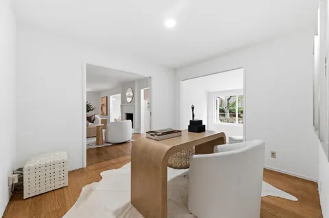 a living room with furniture and a table