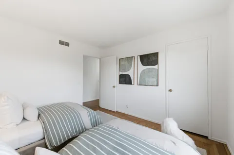 a bedroom with a bed and closet
