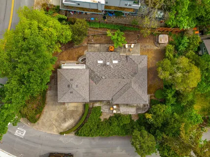 an aerial view of a house with a garden