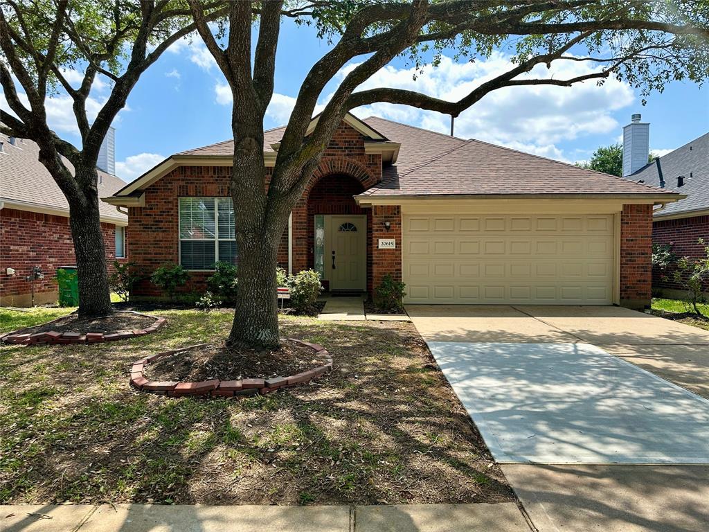 20615 Mauve Orchid Way Cypress, TX 77433 - Photo 1 of 30 a front view of a house with garden