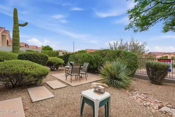 a view of a backyard with a patio