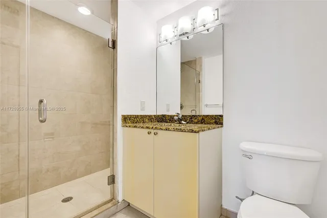 a view of a house with sitting area and potted plants