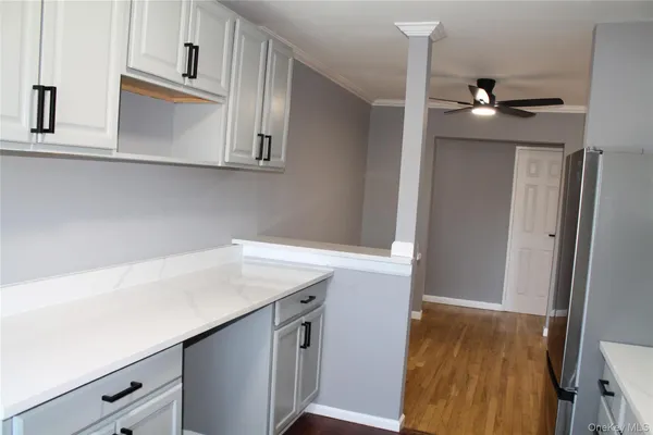 a room with cabinets and wooden floor