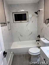 a bathroom with a toilet a sink and a bathtub