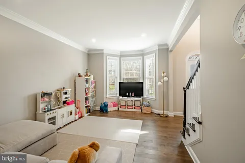 a bathroom with a sink toilet and a window