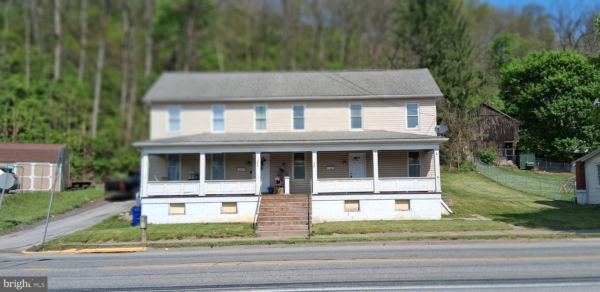 front view of a house with a yard