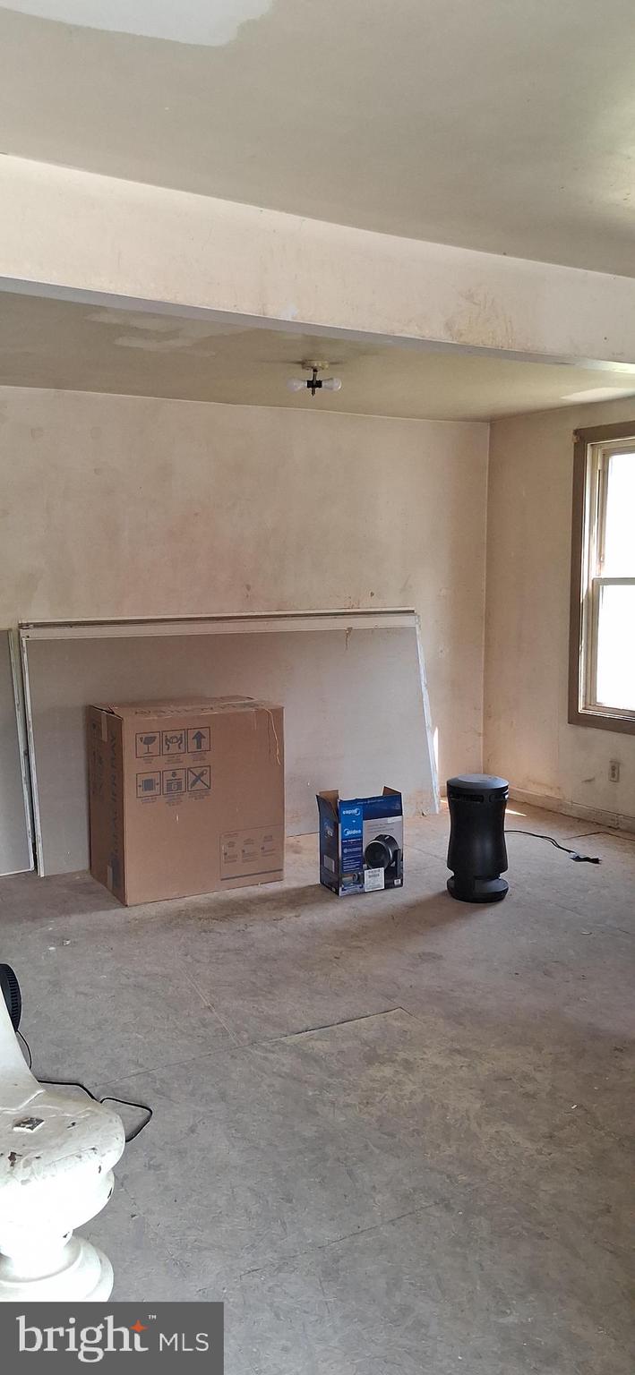 327-329 West Main Street Everett, PA 15537 - Photo 35 of 81 a view of a livingroom with an empty space and a window