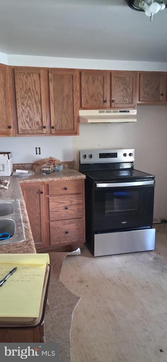 327-329 West Main Street Everett, PA 15537 - Photo 46 of 81 a stove top oven sitting inside of a kitchen