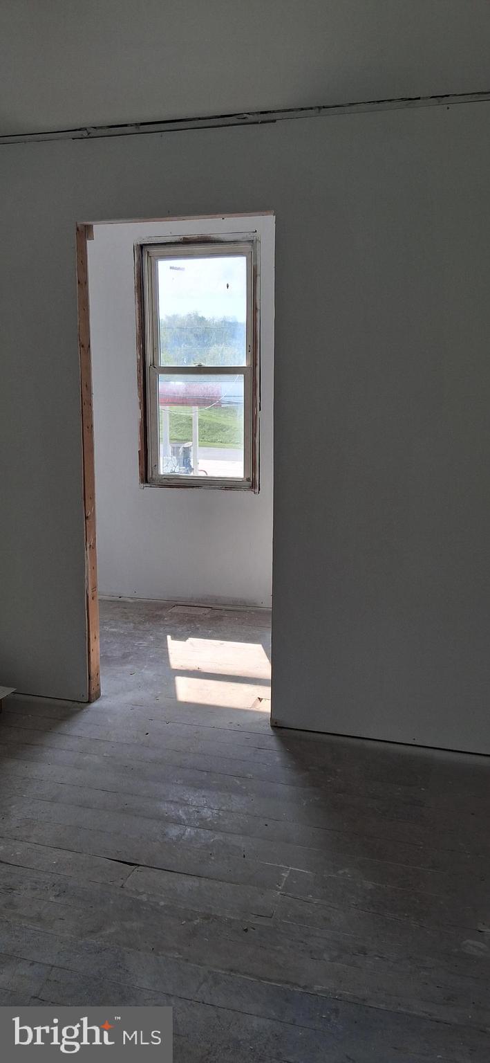 327-329 West Main Street Everett, PA 15537 - Photo 60 of 81 a view of empty room with wooden floor and fan