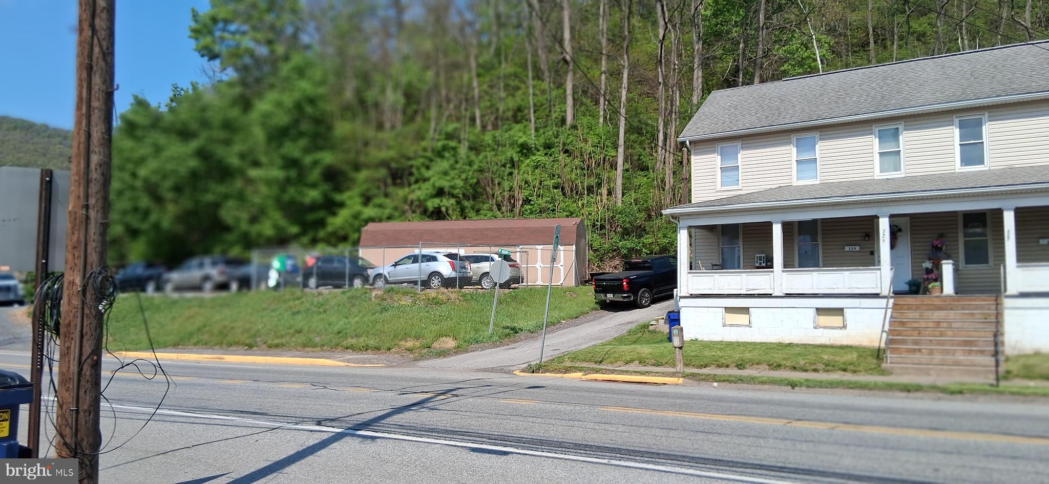 327-329 West Main Street Everett, PA 15537 - Photo 6 of 81 front view of house with a yard